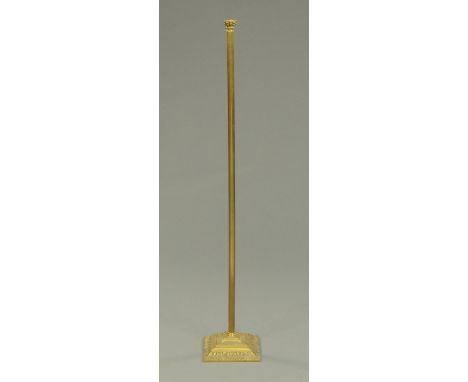 A brass standard lamp, with square base.