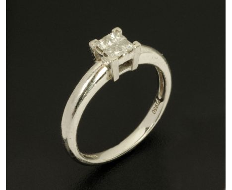 A platinum ring, set with four small diamonds, size K/L.