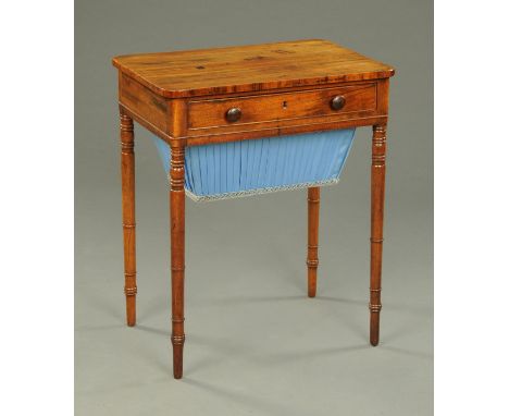 A Regency mahogany worktable, rectangular, with rounded corners, frieze drawer with wooden knob handles, blue pleated cloth b