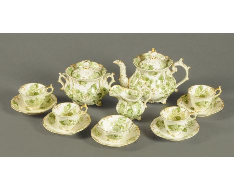 A late Victorian ware tea set, green and gilt with crown finial to teapot lid, 13 pieces.  CONDITION REPORT: The teapot is in