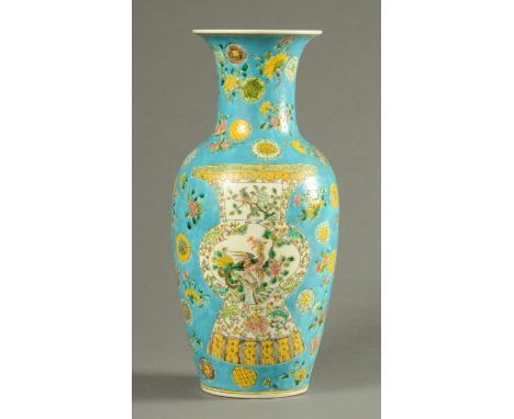 A Chinese vase, with blue ground decorated with a double gourd vase and with six character mark to base.  Height 46 cm.  COND