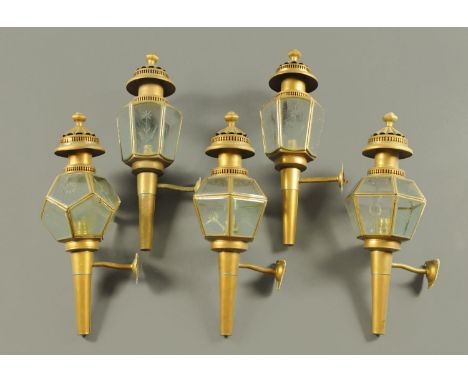Five carriage lamps, two pairs and a single lamp.  Each height approximately 58 cm. 