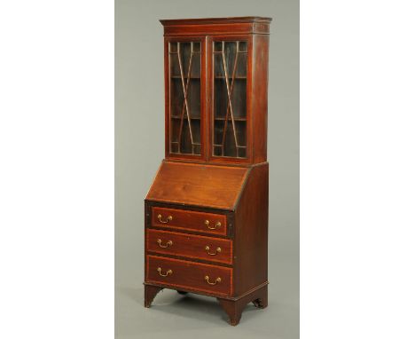 An Edwardian inlaid mahogany bureau bookcase, with moulded cornice above a pair of glazed doors enclosing shelves, the base w