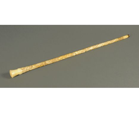 An Oriental carved bone walking stick.