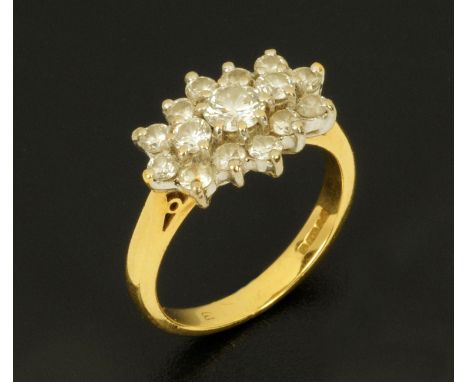 An 18 ct gold diamond set cluster ring, size K/L.