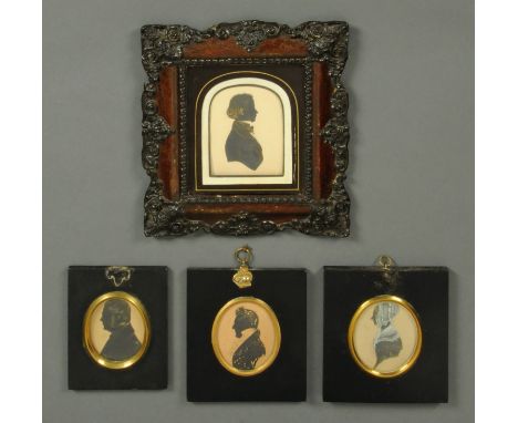 Four 19th century profile silhouette portrait miniatures, three gentlemen and one lady.  Largest frame size 23 cm x 20.5 cm. 