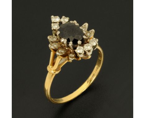 An 18 ct gold sapphire and diamond cluster ring, size Q/R.