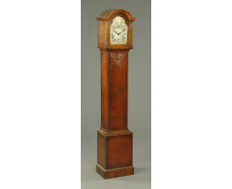 An oak cased grandmother clock, with three-train spring driven movement, carved case and raised on a plinth base.  Height 167