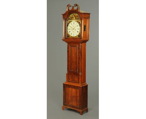 An early 19th century mahogany longcase clock, with swans neck pediment above the arched painted dial and eight day striking 