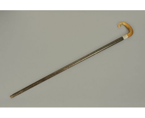 A late 19th century walking stick, with horn handle and silver mount.