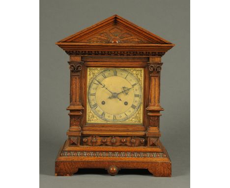 A late 19th century oak mantle clock, with two-train spring driven movement striking on a single gong, with brass dial.  Heig