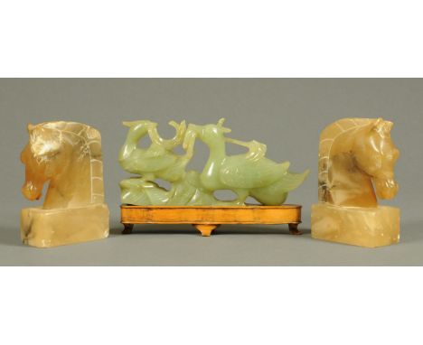 A Chinese jade carving, ducks, length 26 cm, and a pair of carved alabaster bookends, horses.