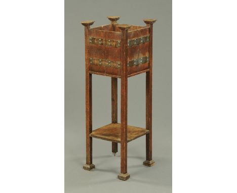 An Art Nouveau oak plant stand, with metal mounts, and a tapestry fire screen. 