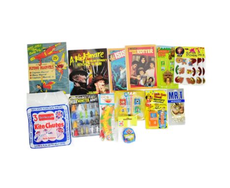 A collection of vintage childrens rack pack toys to include; Doctor Who Mega Monster Army, Smokey Bear Alert Whistle, Mr T Ai