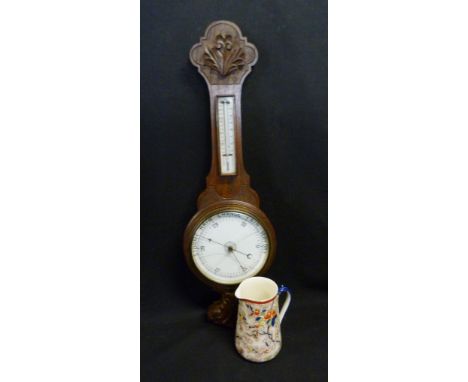 An Early 20th Century Oak Barometer Thermometer together with a Victorian Corona Ware Jug