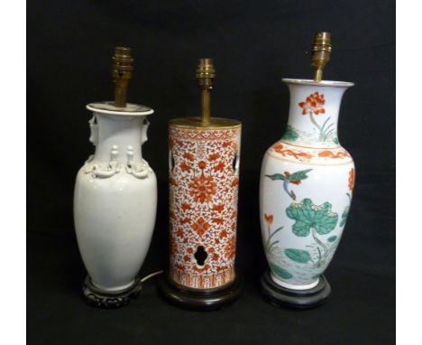 A Chinese Porcelain Table Lamp, decorated in iron red together with two other similar porcelain table lamps