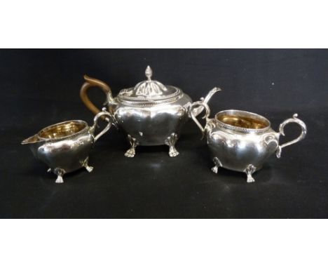 An Edwardian Silver Three Piece Tea Service of Shaped Form, comprising teapot, cream jug and sucrier, Birmingham 1901, 15 ozs