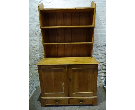 A 19th Century Pine Small Dresser, the boarded shelf back above two panel doors and two drawers below flanked by stiles, 95 c