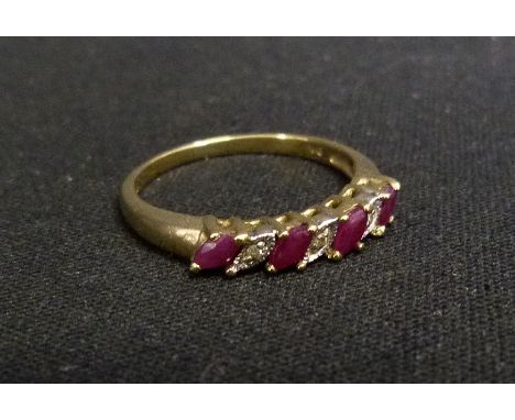 A 9ct. Gold Ruby and Diamond Band Ring, set with four rubies and four diamonds within pierced setting