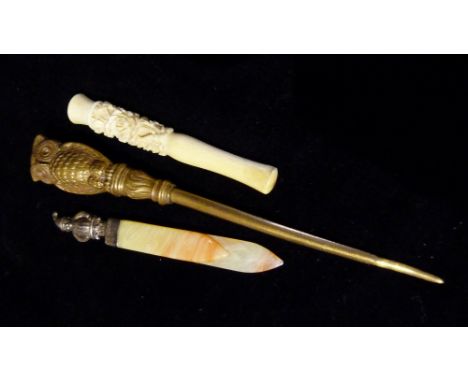 A Punch Bookmark, together with a cheroot holder and a button hook with a handle in the form of an owl