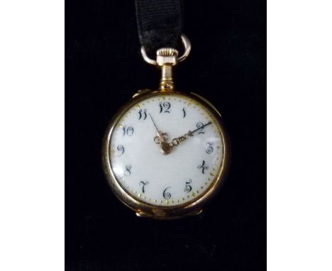 A Yellow Metal Fob Watch, the enamel dial with Arabic numerals and with engraved back plate