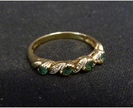 A 9ct Gold Emerald and Diamond Band Ring, set with four emeralds and three diamonds