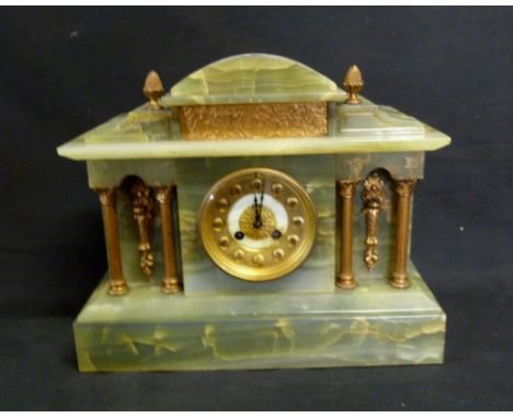 A Late Victorian Early Edwardian Onyx Mantle Clock, the enamel dial with Roman numerals and four corinthian columns