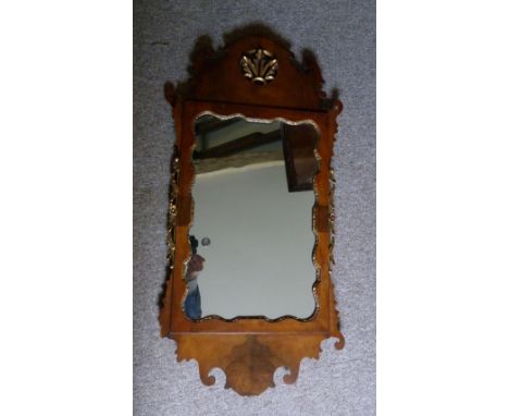 A 19th Century Mahogany Chippendale Style Wall Mirror with carved gilded cresting, 94 x 51 cms