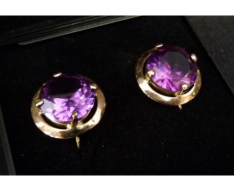 A Pair of 9ct. Gold Amethyst Set Ear Clips