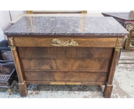 COMMODE, French Empire mahogany and gilt metal mounted with four drawers between columns and a grey marble top, 130cm x 62cm 