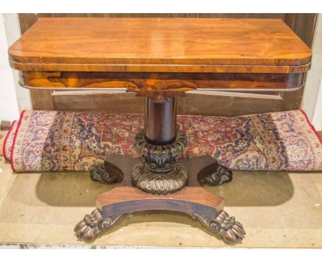 CARD TABLE, William IV rosewood with red baize lined foldover top on leaf carved pedestal and castors, 73cm H x 92cm x 45cm.