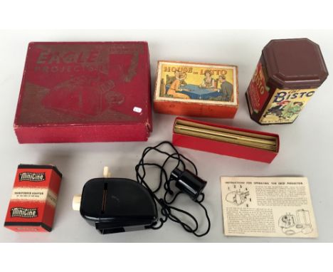 A 1950s Eagle comics projector and slides together with a vintage Bisto tin and 'House or Lotto' board game