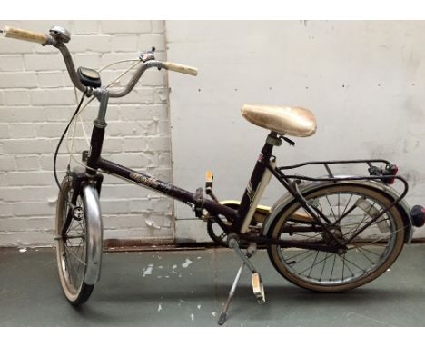 A vintage Halfords Alpha Twenty bicycle with attached Sanyo spedometer