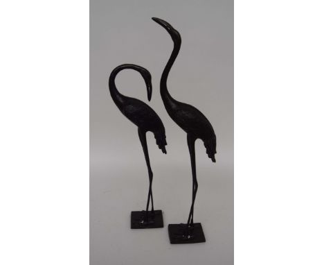 A pair of 20th century Japanese bronze cranes, 51cmH and 63cmH 