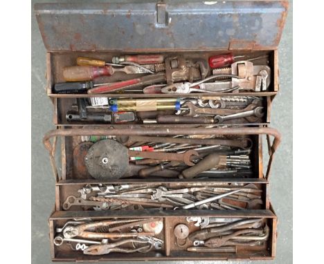 An Enox vintage metal tool box containing a quantity of tools including wrenchs and pliers