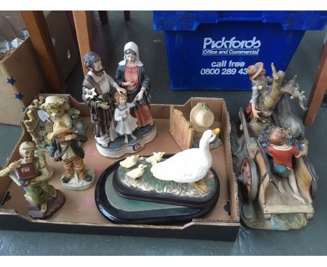 A quantity of ceramic figurines of various styles