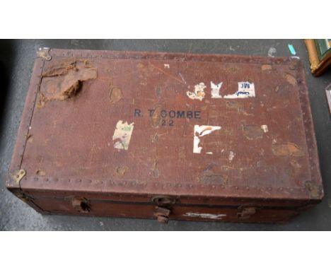 A pine and painted hessian vintage school trunk with various labels 68 x 22 x 42cm together with one other brown suitcase 36 