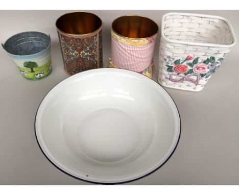 A large white enamel bowl with blue lip together with three small bathroom bins, a small galvanised bucket and others