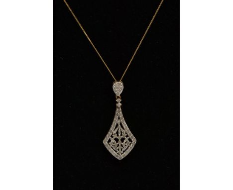 A SILVER GILT DIAMOND SET PENDANT NECKLACE, the pendant of a kite shape set with a single cut and tapered cut diamonds, fitte
