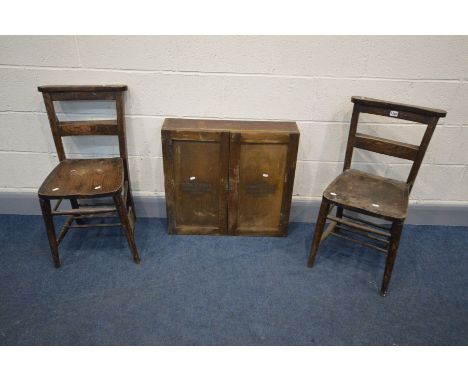 A VINTAGE OAK STORAGE CABINET, the double doors labelled 'ROYAL EDISON MOTOR LAMP BULBS' enclosing twenty four pigeon holes, 