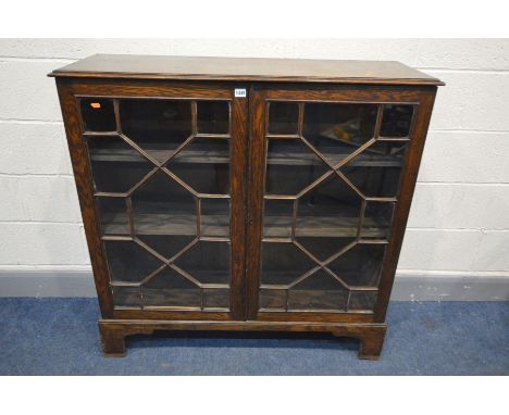 A 19TH CENTURY OAK TWO DOOR ASTRAGAL GLAZED BOOKCASE, on bracket feet, width 110cm x depth 37cm x height 110cm