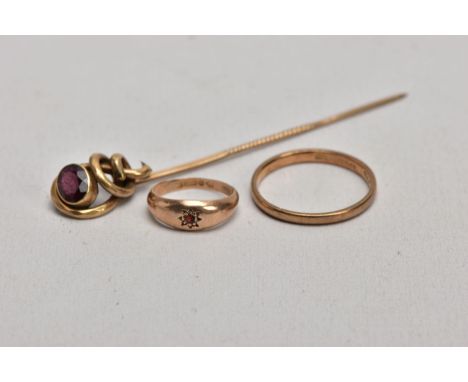 TWO 9CT GOLD RINGS AND A YELLOW METAL GARNET SET STICK PIN, the first a thin plain polished band, hallmarked 9ct gold Chester