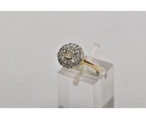 A 9CT GOLD DIAMOND CLUSTER RING, of a circular design, the central part set with four princess cut diamonds, within a surroun