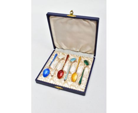 A CASED SET OF SIX GUILLOCHE ENAMELLED TEASPOONS, each with a tapered gilt handle applied bead to the terminal, each in an in