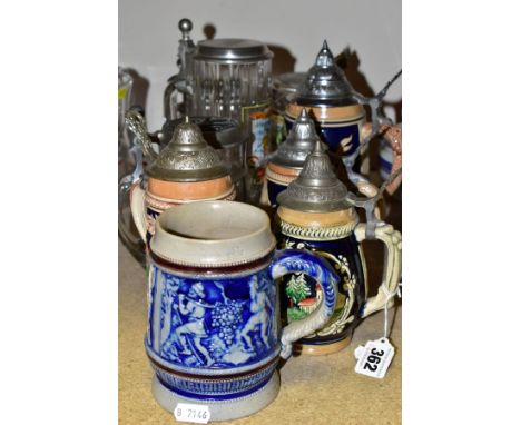 NINE STEINS, FIVE CERAMIC AND FOUR GLASS, eight with lids (large chip and extensive crack to one of the glass handles, two of