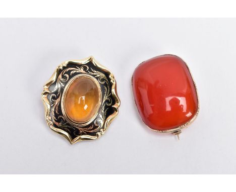TWO YELLOW METAL BROOCHES, the first a carnelian cabochon brooch of a rounded rectangular form, fitted with a brooch pin, len