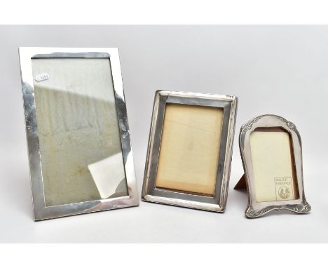 THREE SILVER PICTURE FRAMES, to include a large rectangular plain polished frame, hallmarked Birmingham, a smaller rectangula