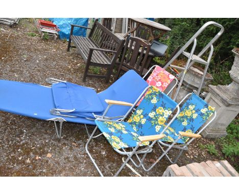 THREE 1970S METAL FOLDING CHAIRS with floral fabric coverings, a lounger, a metal washboard and a set of aluminium step ladde
