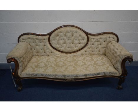 A VICTORIAN MAHOGANY SOFA, the wavy back to scrolled armrests, serpentine front, on cabriole legs, and ceramic casters, lengt