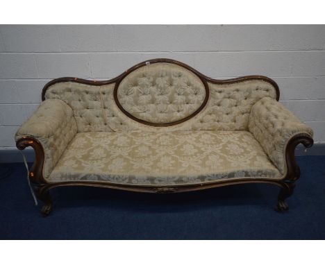 A VICTORIAN MAHOGANY SOFA, the wavy back to scrolled armrests, serpentine front, on cabriole legs, and ceramic casters, lengt